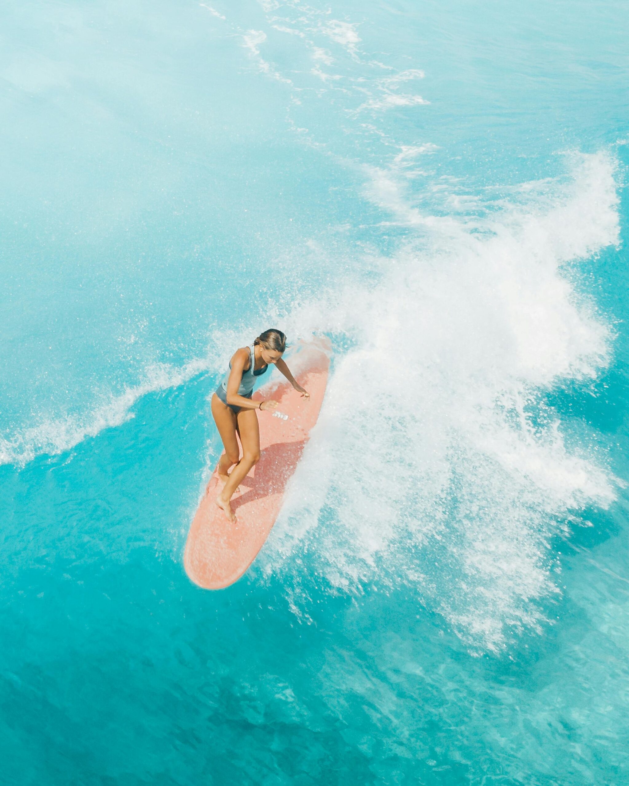 Woman surfing in Oahu